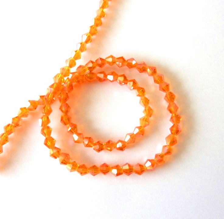  Perles en cristal toupies de 4 mm orange reflet sur fil de 30cm